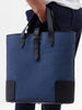 man holding DeuxMag big canvas and leather blue marine and black Tote bag 